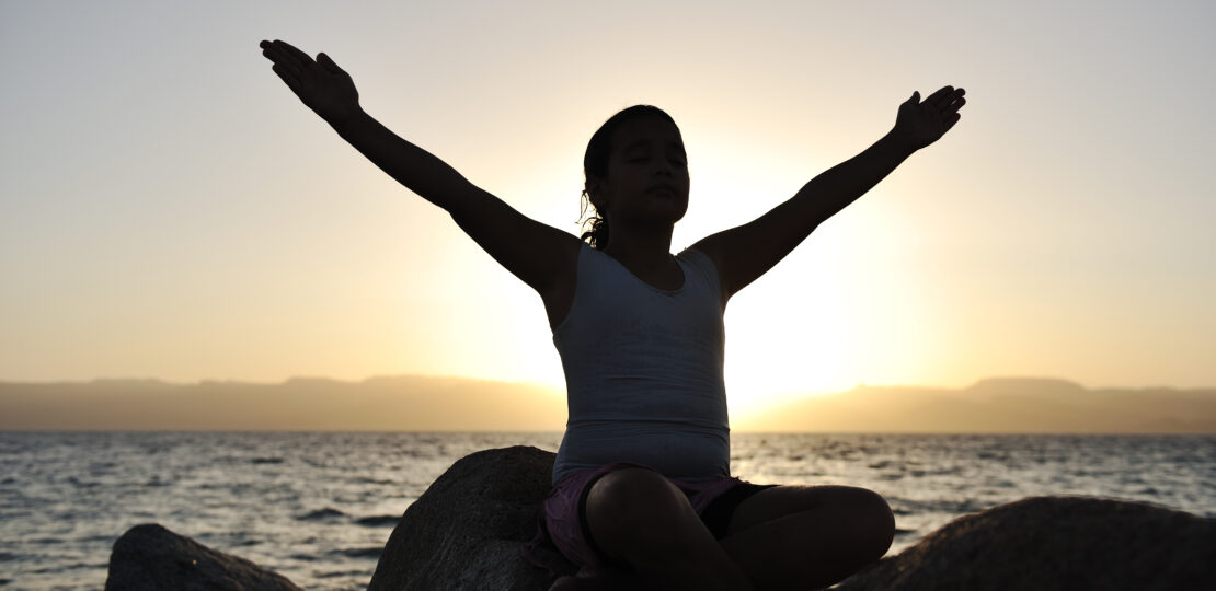 Girl on sunset excercising