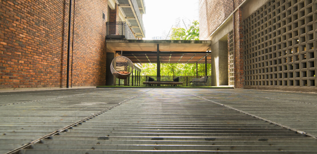 house with patio leading to garden