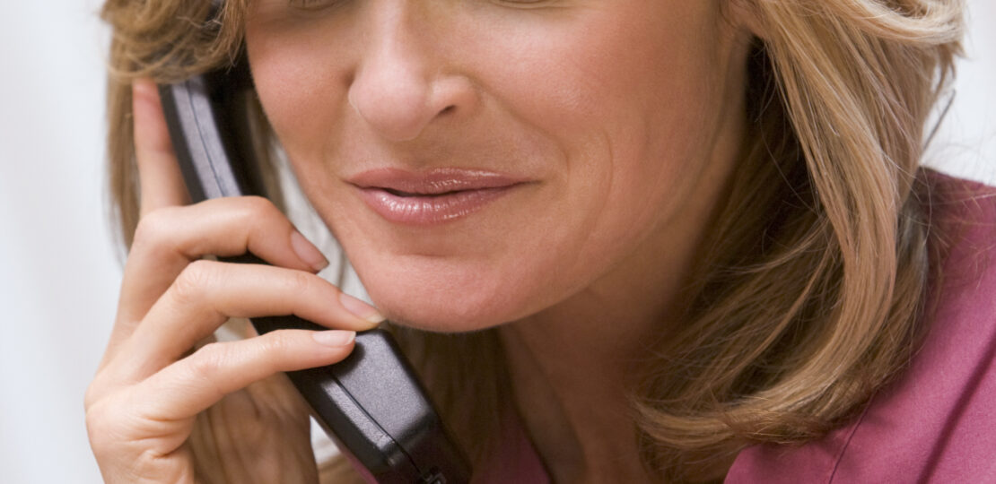 Consultant phoning client with good news