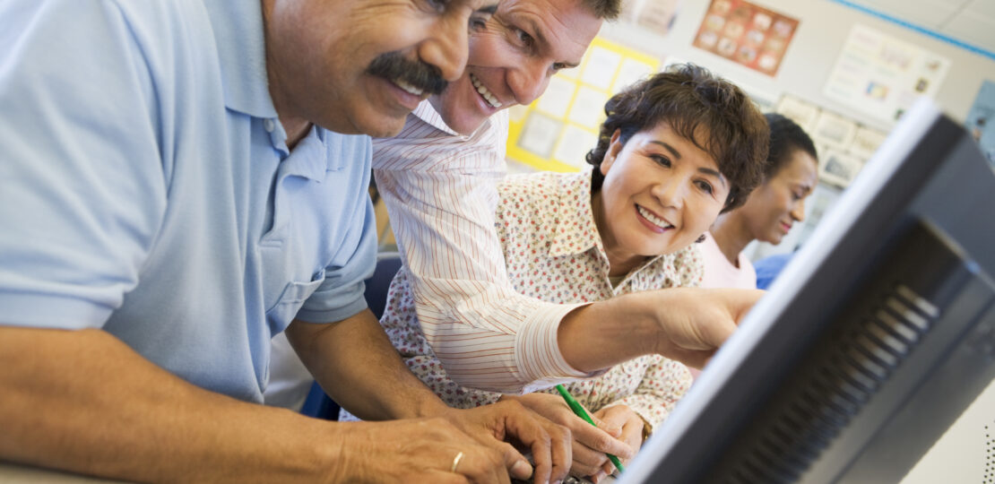 Mature students learning computer skills